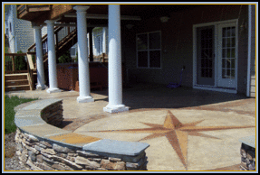 Stone Walls and Stamped Concrete Patio with Compass Artwork